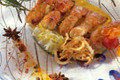 Brochette de langoustines caramélisées à la confiture de mandarine, délicatement parfumé au curry de madras