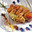 Brochette de langoustines caramélisées à la confiture de mandarine, délicatement parfumé au curry de madras