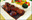 Enrober les cubes de poulet de fécule de maïs.