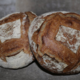Grands pains semi-complets (Type 80) au levain, cuits au feu de bois.